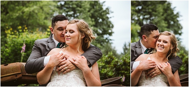Premier snohomish & seattle wedding photographer | gsquared weddings photography a groom in a gray suit lovingly embraces and kisses his smiling bride who is wearing a white lace wedding dress as they sit outdoors surrounded by green foliage at their snohomish seattle wedding engagement | serving snohomish seattle & beyond Premier snohomish & seattle wedding photographer | gsquared weddings photography a groom in a gray suit lovingly embraces and kisses his smiling bride who is wearing a white lace wedding dress as they sit outdoors surrounded by green foliage at their snohomish seattle wedding engagement | serving snohomish seattle & beyond