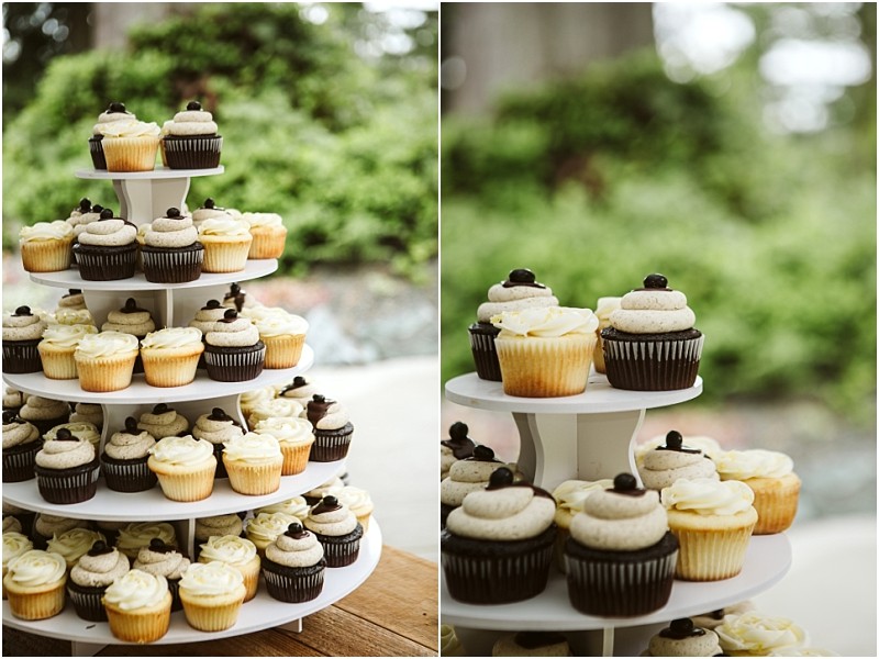 Premier snohomish & seattle wedding photographer | gsquared weddings photography a tiered white cupcake stand holds chocolate and vanilla cupcakes decorated with swirled frosting and small toppings set outdoors with greenery in the backgroundperfect for a snohomish or seattle wedding engagement celebration | serving snohomish seattle                   & beyond