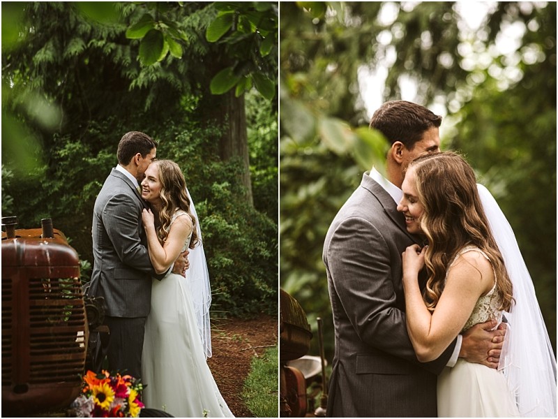 Premier snohomish & seattle wedding photographer | gsquared weddings photography a bride and groom embrace lovingly outdoors surrounded by lush greenery at a snohomish seattle wedding The groom wears a gray suit and the bride a white dress with a veil Both are smiling and appear happy and affectionate | serving snohomish seattle                   & beyond