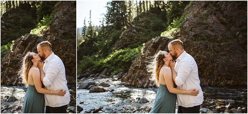Premier snohomish & seattle wedding photographer | gsquared weddings photography a couple embraces and laughs by a rocky riverbank with trees and a mountain in the background sunlight streaming through the scenecapturing the magic of a snohomish seattle wedding engagement | serving snohomish seattle                   & beyond