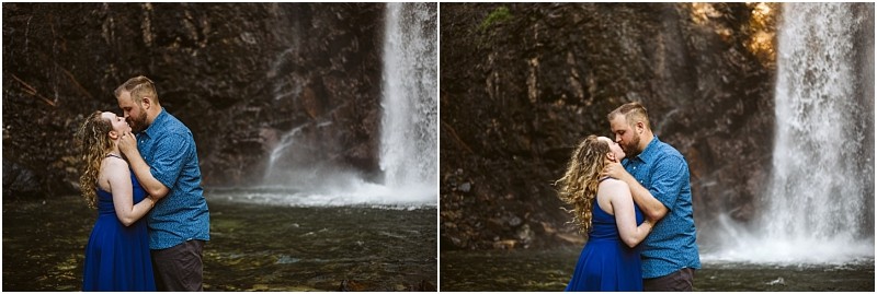 Premier snohomish & seattle wedding photographer | gsquared weddings photography a couple embraces and kisses in front of a waterfall during their snohomish seattle wedding engagement The woman wears a blue dress the man a blue shirt with rushing water and a rocky cliffside in the background | serving snohomish seattle                   & beyond