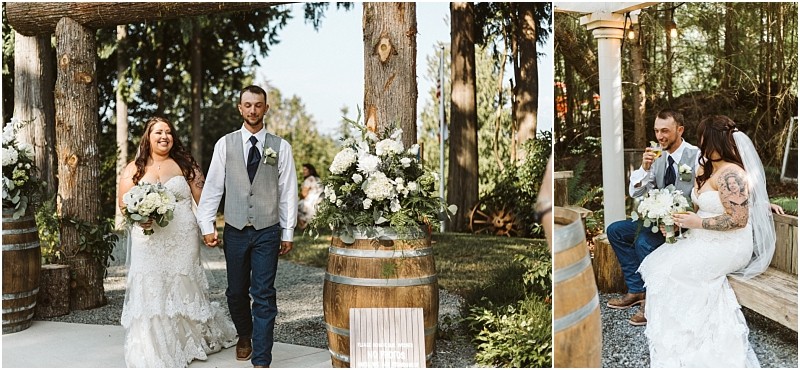 A bride and groom walk hand in hand outdoors near floral arrangements and wine barrels in snohomish In a second image they sit together on a bench laughing and enjoying drinks in a rustic wooded setting Snohomish wedding photography