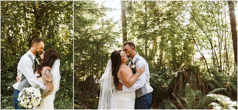 A bride and groom embrace and share a kiss in a lush sunlit snohomish forest The bride holds a bouquet of white flowers and wears a veil while the groom is dressed in a vest and tie Both appear joyful and in love Snohomish wedding photography