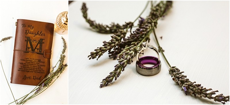 A leather journal with to my daughter inscribed sprigs of lavender a purple gemstone ring and a silver band arranged on a white surfaceperfect for capturing memories in charming snohomish style Snohomish wedding photography