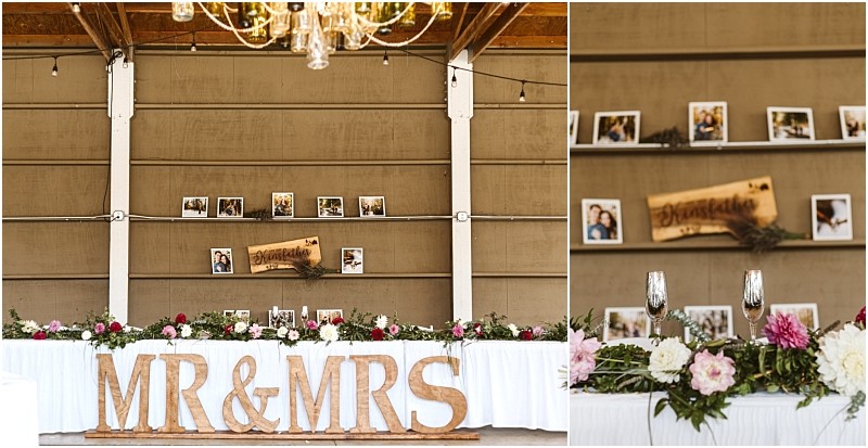 A rustic snohomish wedding reception setup features a large mr & mrs sign before a flower adorned long table Behind shelves display framed photos and a wooden congratulations sign Snohomish wedding photography