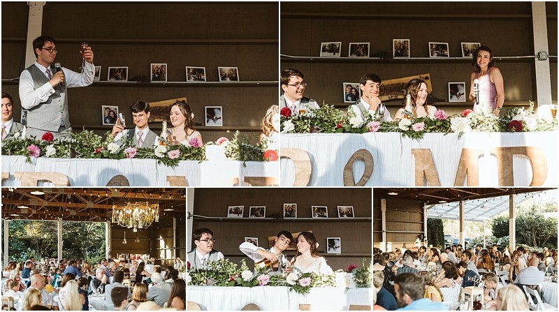 A wedding reception in snohomish with guests seated at tables while the head table adorned with flowers and photos hosts speeches from the wedding party in a rustic open air venue Snohomish wedding photography