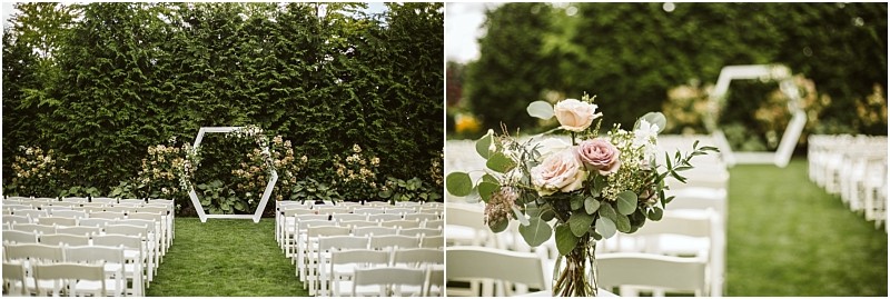 Rows of white chairs are set up outdoors on grass in picturesque snohomish facing a geometric hexagonal wedding arch adorned with greenery and flowers with a bouquet of pink and white flowers placed on one chair Snohomish wedding photography