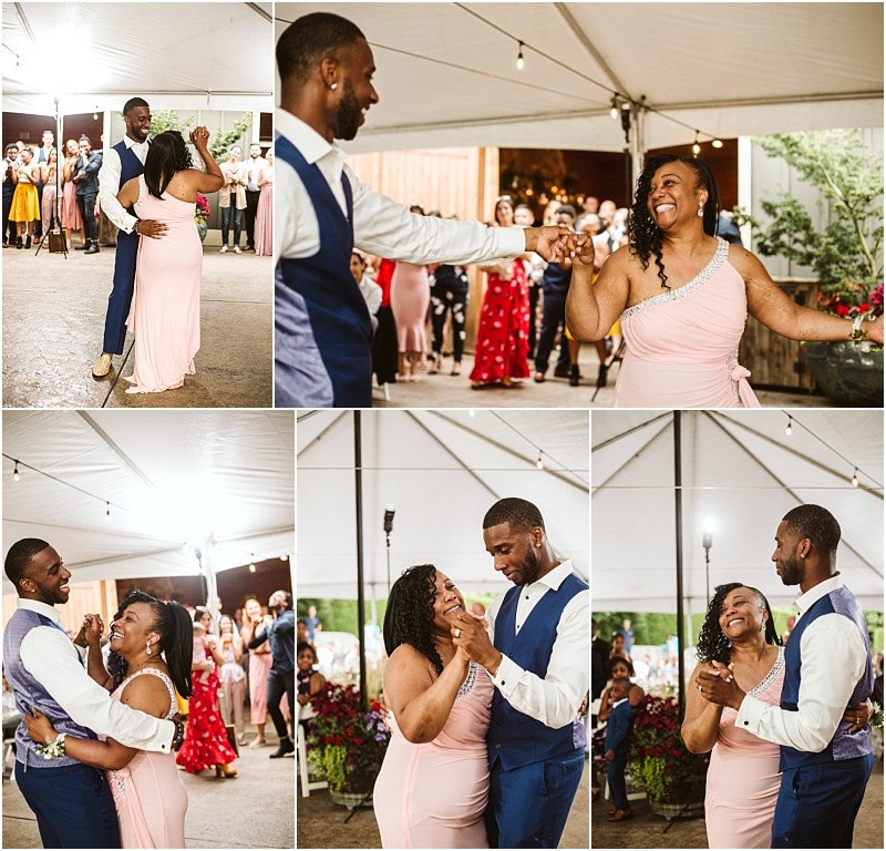A man in a blue vest and a woman in a pink dress joyfully dance together under a tent at a snohomish celebration surrounded by smiling guests watching and cheering them on Snohomish wedding photography