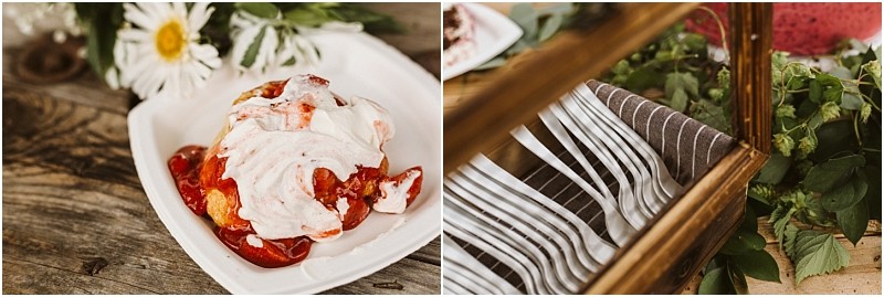 A close up of a dessert with strawberries and whipped cream in a white dish on a wooden table in snohomish next to a daisy flower beside it a basket holds neatly arranged silver forks and a brown striped napkin Snohomish wedding photography