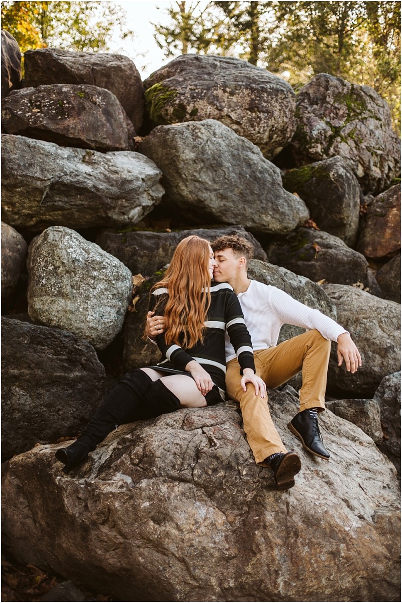 Premier snohomish & seattle wedding photographer | gsquared weddings photography a couple sits on large rocks outdoors near snohomish facing each other closely The woman has long red hair and a striped sweater the man wears a white shirt and khaki pantsthey share an intimate moment during their seattle engagement | serving snohomish seattle & beyond Premier snohomish & seattle wedding photographer | gsquared weddings photography a couple sits on large rocks outdoors near snohomish facing each other closely The woman has long red hair and a striped sweater the man wears a white shirt and khaki pantsthey share an intimate moment during their seattle engagement | serving snohomish seattle & beyond