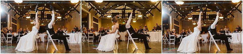 Premier snohomish & seattle wedding photographer | gsquared weddings photography a bride and groom sit back to back on chairs at their snohomish wedding each raising one arm while guests seated at round tables watch and smile in a warmly lit reception hall | serving snohomish seattle                   & beyond