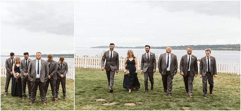 Premier snohomish & seattle wedding photographer | gsquared weddings photography a wedding party in suits and dark dresses walks and stands on a grassy area near a white fence with water and a cloudy sky in the backgroundcapturing timeless moments from this beautiful snohomish seattle wedding | serving snohomish seattle                   & beyond
