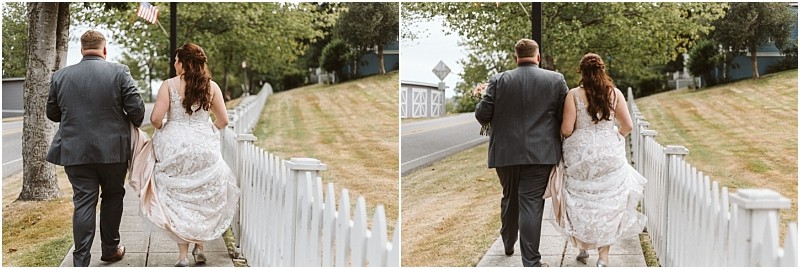 Premier snohomish & seattle wedding photographer | gsquared weddings photography a bride and groom walk side by side on a sidewalk next to a white picket fence with trees and grass on both sides photographed from behind on a cloudy snohomish seattle wedding day | serving snohomish seattle                   & beyond