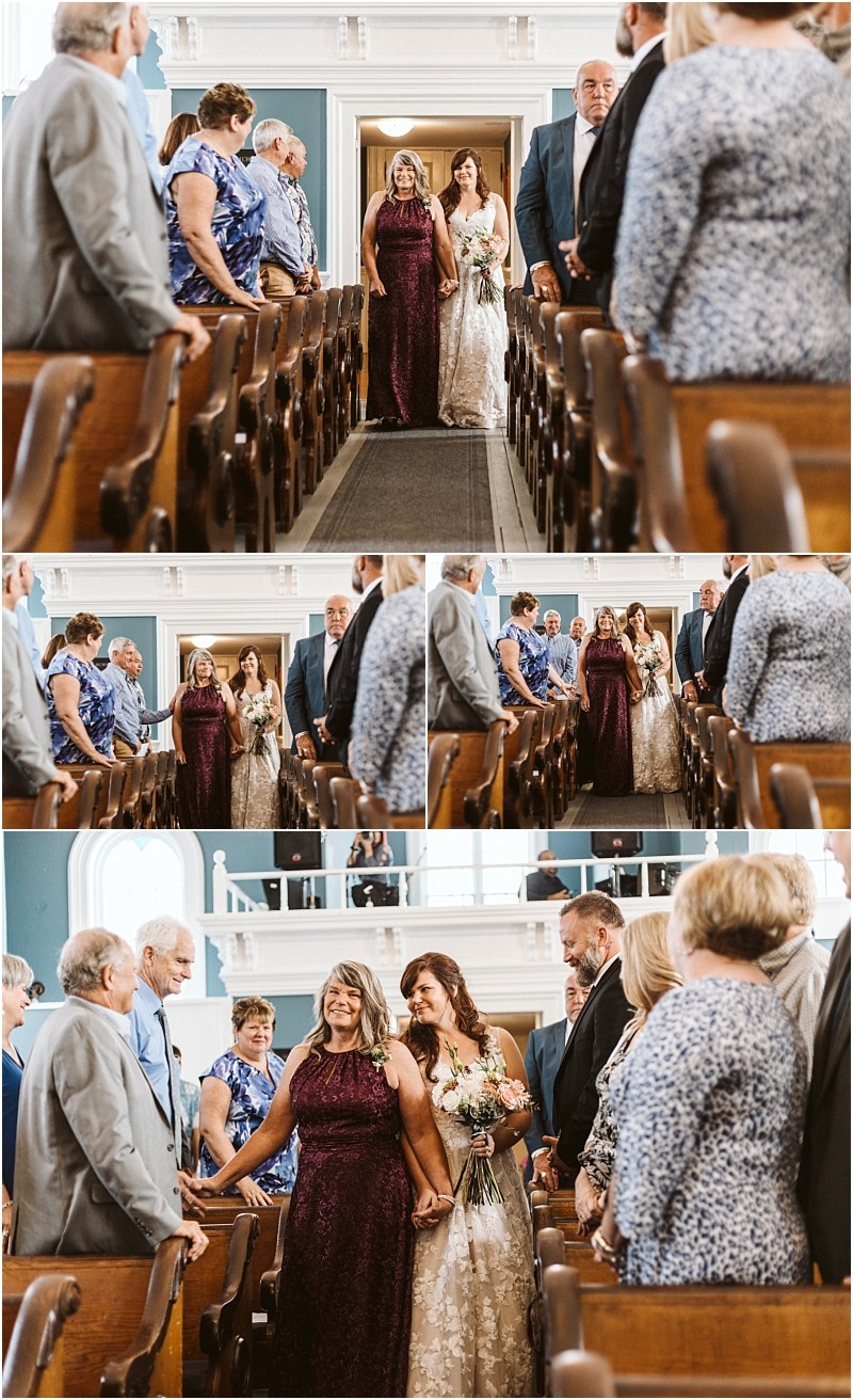 Premier snohomish & seattle wedding photographer | gsquared weddings photography a bride in a white dress walks down a church aisle arm in arm with a woman in a purple gown smiling at guests during this elegant snohomish seattle wedding ceremony surrounded by stunning architecture and joyful onlookers | serving snohomish seattle                   & beyond