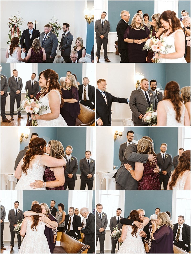 Premier snohomish & seattle wedding photographer | gsquared weddings photography a bride hugs and shares emotional moments with loved ones during a snohomish wedding ceremony in a bright room with guests and groomsmen from seattle watching and smiling | serving snohomish seattle                   & beyond