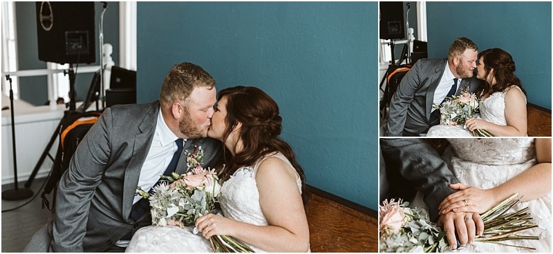 Premier snohomish & seattle wedding photographer | gsquared weddings photography a bride and groom in wedding attire share a kiss while sitting on a bench The bride holds a bouquet their hands gently touching in this close up from a snohomish seattle wedding set against a teal wall with speakers in the background | serving snohomish seattle                   & beyond