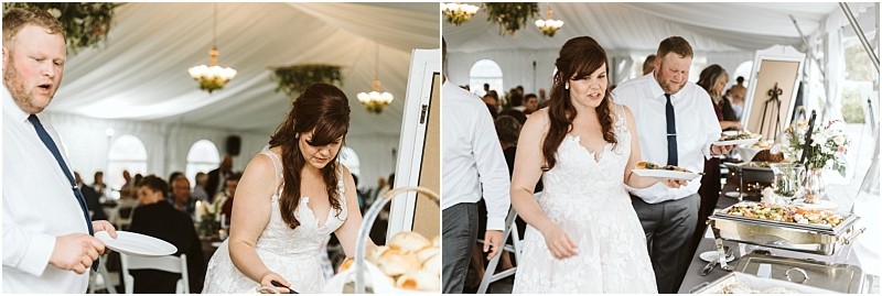 Premier snohomish & seattle wedding photographer | gsquared weddings photography a bride and guests in formal attire serve themselves food from a buffet table under a white tent at a lively and festive snohomish wedding reception with decorated tables in the background | serving snohomish seattle                   & beyond
