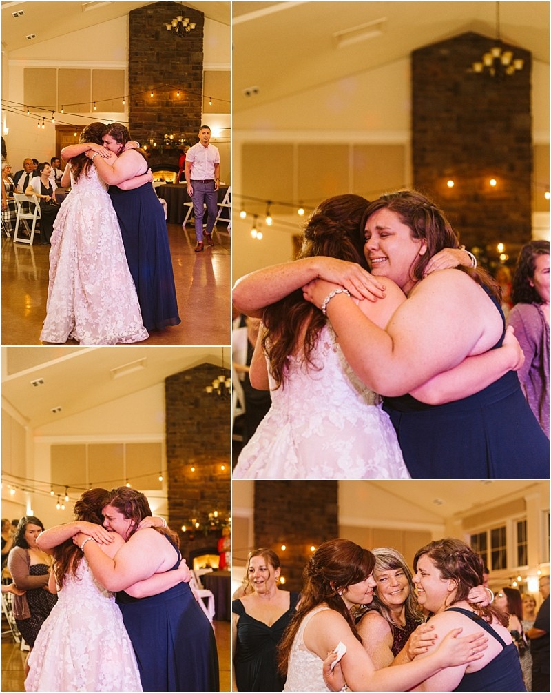 Premier snohomish & seattle wedding photographer | gsquared weddings photography a bride in a white gown and a woman in a navy dress share an emotional embrace and tears on the dance floor surrounded by wedding guests at a warmly lit snohomish seattle wedding reception | serving snohomish seattle                   & beyond