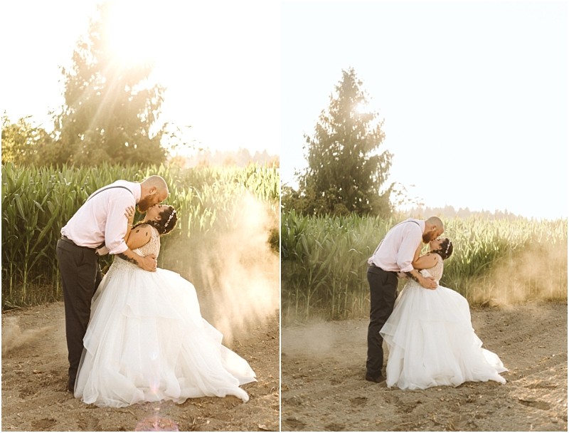 Premier snohomish & seattle wedding photographer | gsquared weddings photography a couple in wedding attire shares a romantic kiss outdoors at sunset near snohomish surrounded by sunlight and dust by a field of tall green corn perfect for a seattle wedding engagement with trees in the background | serving snohomish seattle                   & beyond