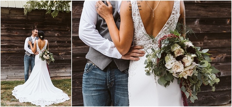 Premier snohomish & seattle wedding photographer | gsquared weddings photography a bride in a white dress holding a bouquet stands with her groom in jeans and a vest embracing outside by a rustic wooden wall The brides back and floral bouquet are prominently visible at this charming snohomish seattle wedding | serving snohomish seattle                   & beyond