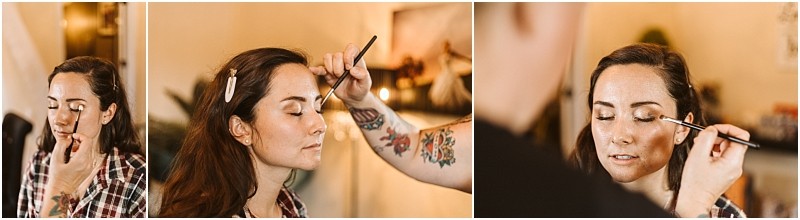Premier snohomish & seattle wedding photographer | gsquared weddings photography a woman with brown hair sits calmly as a makeup artist applies eyeshadow with a brush Ready for her snohomish wedding engagement she wears a plaid shirt and hair clips while the softly blurred background adds a dreamy touch | serving snohomish seattle                   & beyond