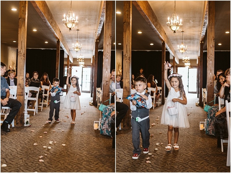 Premier snohomish & seattle wedding photographer | gsquared weddings photography at a snohomish wedding two children walk down the aisle a young boy in a vest tosses petals while a girl in a white dress and flower crown smiles and waves Guests seated in white chairs watch and smile | serving snohomish seattle                   & beyond