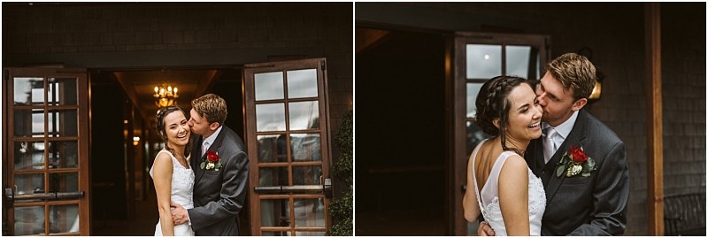 Premier snohomish & seattle wedding photographer | gsquared weddings photography a bride and groom stand smiling and embracing outside a building with wooden doors and warm light inside The groom kisses the bride on the cheek as they both laugh celebrating their snohomish wedding day | serving snohomish seattle                   & beyond