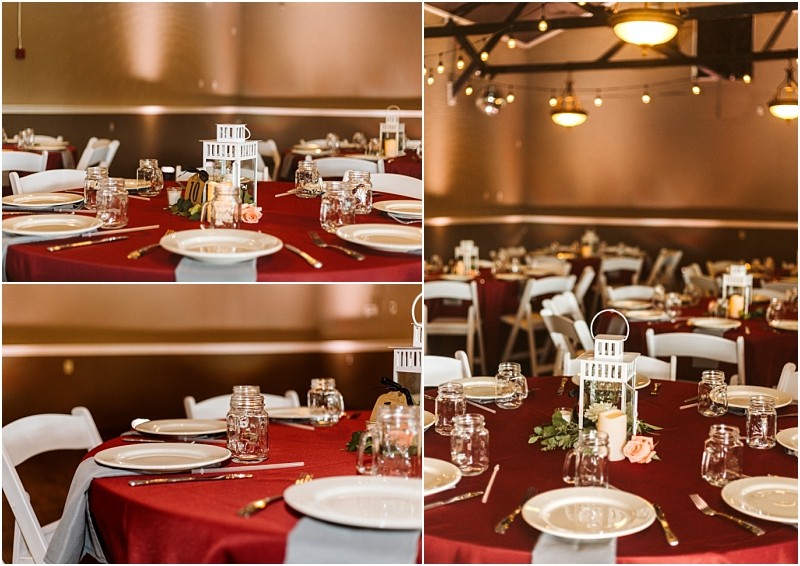 Premier snohomish & seattle wedding photographer | gsquared weddings photography tables set for a snohomish wedding or seattle engagement featuring red tablecloths white plates mason jar glasses gold utensils and white lantern centerpieces with greenery and pink flowers warm lighting in the background | serving snohomish seattle                   & beyond