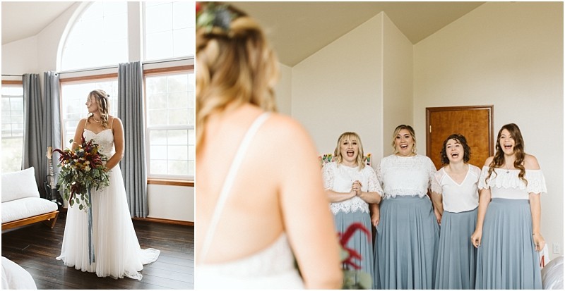 Premier snohomish & seattle wedding photographer | gsquared weddings photography a bride in a white dress holds a bouquet and stands by a window while four bridesmaids in matching blue skirts and white tops smile excitedly at her inside a bright room during a beautiful snohomish seattle wedding | serving snohomish seattle                   & beyond