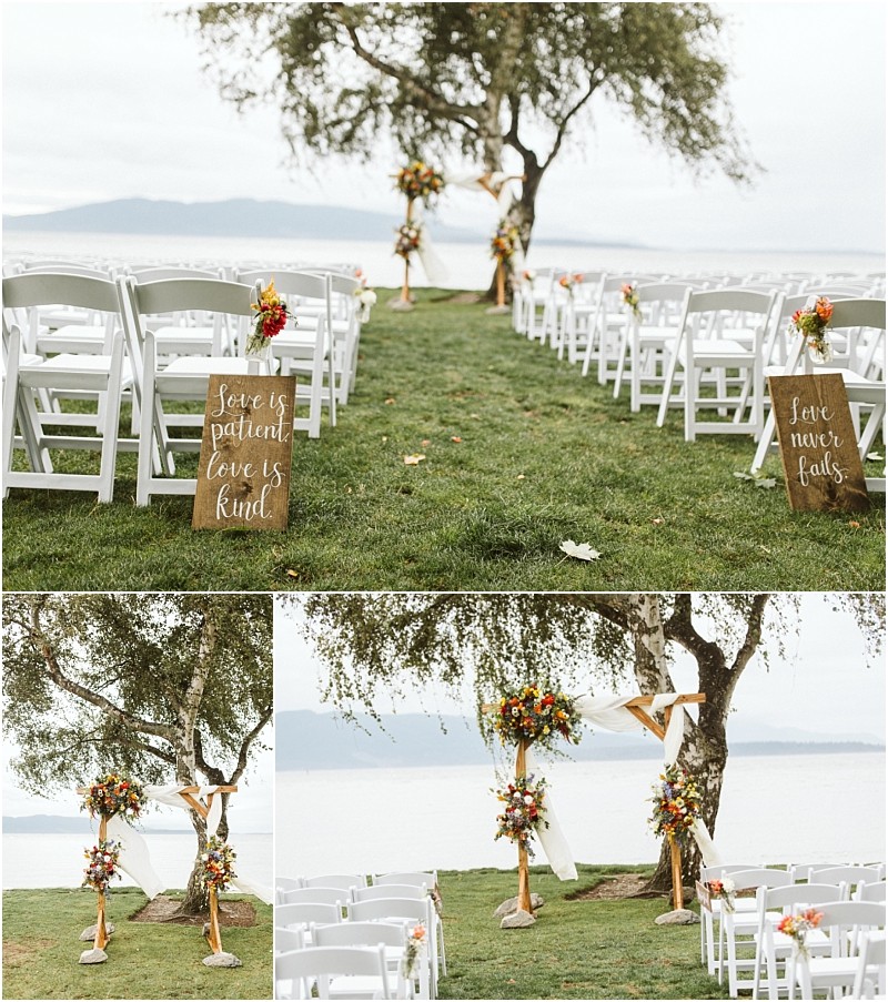 Premier snohomish & seattle wedding photographer | gsquared weddings photography an outdoor snohomish wedding setup by a lake features rows of white chairs floral arrangements and two wooden signs with love is patient love is kind and love never fails in elegant white script | serving snohomish seattle                   & beyond