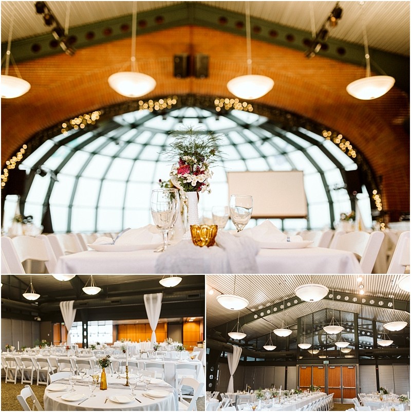 Premier snohomish & seattle wedding photographer | gsquared weddings photography a snohomish wedding venue with round tables set for an event white tablecloths floral centerpieces and elegant lighting under a high arched ceiling with large windows and brick wallsperfect for your seattle engagement | serving snohomish seattle                   & beyond