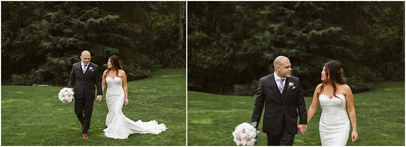 Premier snohomish & seattle wedding photographer | gsquared weddings photography a bride in a strapless white gown and a groom in a dark suit walk hand in hand on grass beneath trees The groom holds a bouquet Both smile at each other capturing the joy of their snohomish seattle wedding engagement | serving snohomish seattle                   & beyond