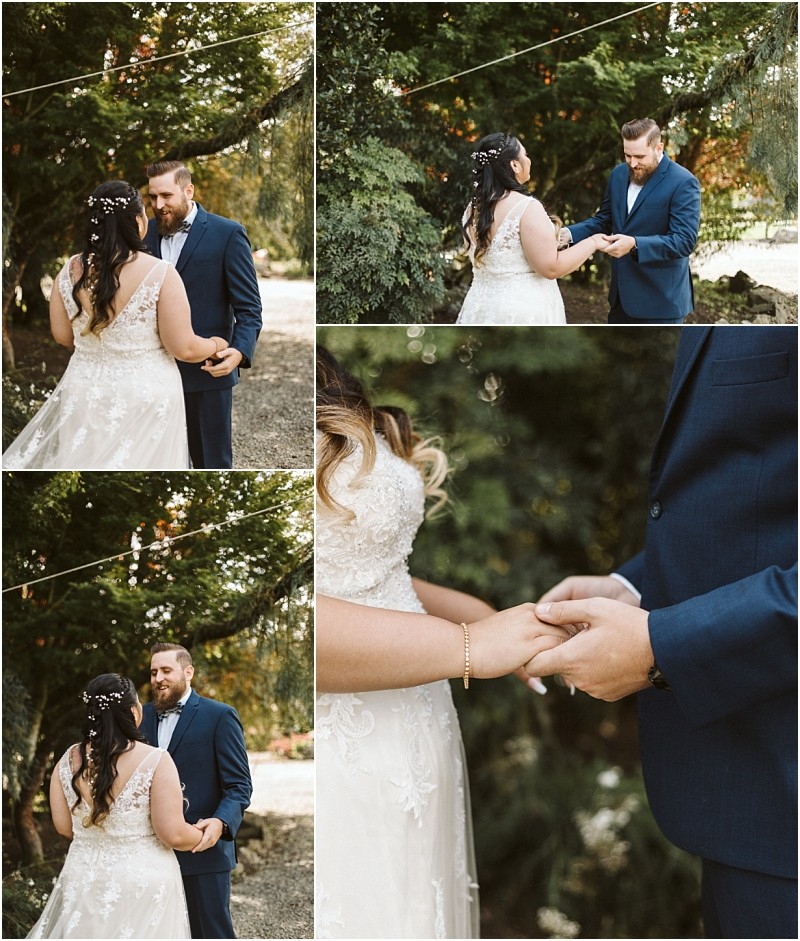 Premier snohomish & seattle wedding photographer | gsquared weddings photography a bride and groom share an emotional first look outdoors under trees at their snohomish seattle wedding Facing each other they hold hands and smile warmly dressed in a white gown and navy suit Close ups capture loving expressions | serving snohomish seattle                   & beyond