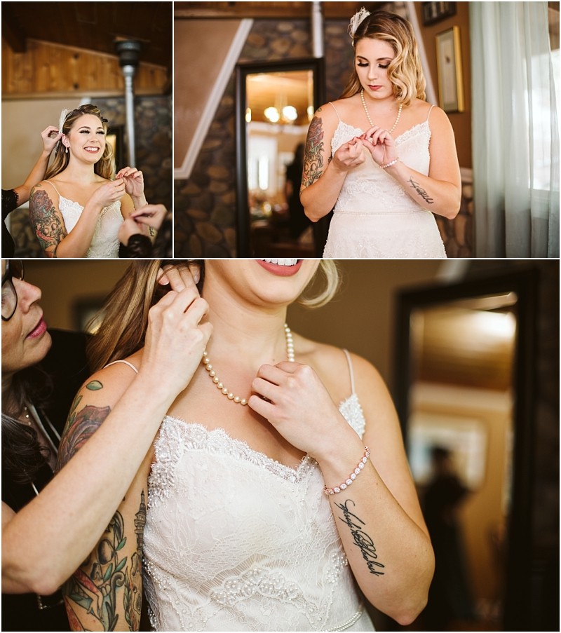Premier snohomish & seattle wedding photographer | gsquared weddings photography a bride in a lace wedding dress smiles as she puts on earrings and a necklace assisted by another person in a cozy wood paneled room with soft lightingcapturing a warm snohomish seattle wedding moment | serving snohomish seattle                   & beyond