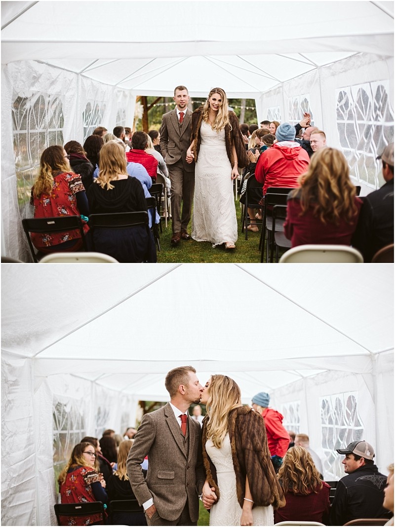 Premier snohomish & seattle wedding photographer | gsquared weddings photography a bride and groom walk down the aisle under a white outdoor canopy at their snohomish wedding surrounded by seated guests In the next image they stop to kiss while guests watch capturing a joyful seattle wedding moment | serving snohomish seattle                   & beyond
