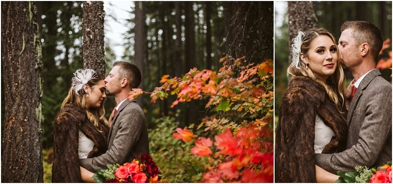 Premier snohomish & seattle wedding photographer | gsquared weddings photography a couple in wedding attire embraces in a forest with autumn foliage near snohomish The groom kisses the brides forehead as she holds a bouquet of red and orange flowers both wear warm clothing for their seattle wedding engagement | serving snohomish seattle                   & beyond