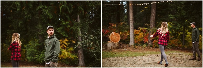 Premier snohomish & seattle wedding photographer | gsquared weddings photography two people outdoors in a wooded area On the left a man in a green hoodie and cap stands beside a woman in a red plaid shirt On the right she walks toward wooden targets while he watchesperfect for a rustic snohomish or seattle engagement session String lights glow above | serving snohomish seattle                   & beyond