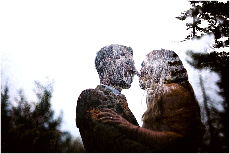 Premier snohomish & seattle wedding photographer | gsquared weddings photography a double exposure image of a snohomish seattle wedding engagement couple facing each other closely about to kiss with a forest scene overlay blending into their silhouettes against a bright sky | serving snohomish seattle                   & beyond