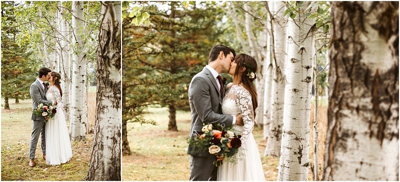 Premier snohomish & seattle wedding photographer | gsquared weddings photography a bride and groom share a kiss among birch trees during their snohomish wedding Surrounded by lush greenery the groom wears a gray suit while the bride in a lace dress holds her bouquet on this enchanting seattle engagement day | serving snohomish seattle                   & beyond