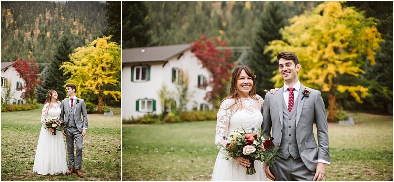 Premier snohomish & seattle wedding photographer | gsquared weddings photography a bride in a white lace dress and a groom in a gray suit with a red tie stand smiling outside on a lawn capturing their snohomish wedding joy amid colorful autumn trees and a white house in the background | serving snohomish seattle                   & beyond