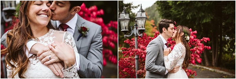 Premier snohomish & seattle wedding photographer | gsquared weddings photography a bride and groom embrace and kiss outdoors during their snohomish seattle wedding surrounded by vibrant red foliage and tall green trees The bride wears a white lace dress and both look happy and in love | serving snohomish seattle                   & beyond