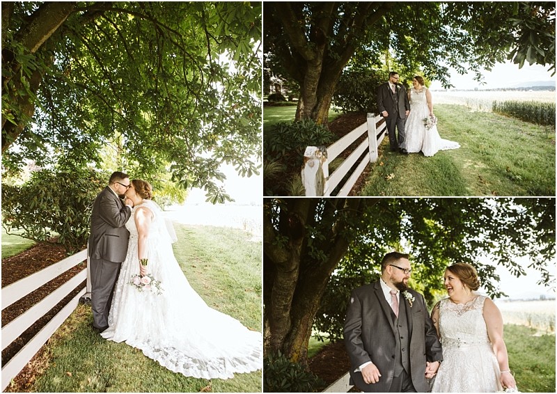 Premier snohomish & seattle wedding photographer | gsquared weddings photography a bride and groom stand together outdoors by a white fence and large green tree sharing loving looks and holding hands on their snohomish wedding day The setting is bright and lush with greenery | serving snohomish seattle                   & beyond