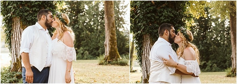 Premier snohomish & seattle wedding photographer | gsquared weddings photography a couple in wedding attire kisses outdoors in front of a tree covered in green ivy surrounded by greenery and warm sunlight Perfect for a romantic snohomish or seattle wedding engagement the bride wears an off shoulder white dress and flower crown | serving snohomish seattle                   & beyond