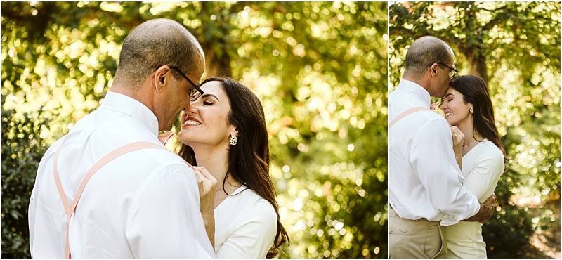 Premier snohomish & seattle wedding photographer | gsquared weddings photography a couple embraces outdoors in soft sunlight during their snohomish seattle engagement The woman smiles with her eyes closed as the man gently holds her both dressed in light colored clothing surrounded by lush green foliage | serving snohomish seattle                   & beyond