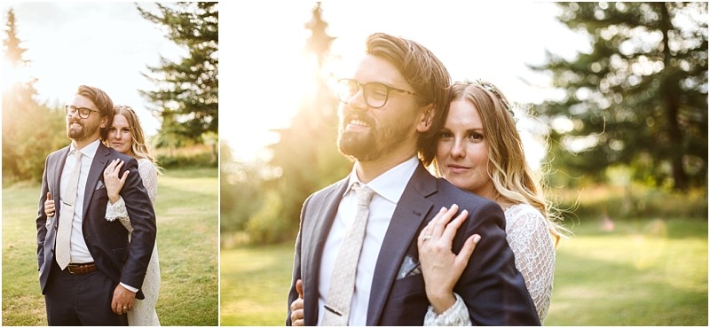 Snohomish & seattle wedding photographer | gsquared weddings photography a bride embraces a groom from behind as they stand outdoors in the sunlight both smiling softly This romantic scene captures the magic of wedding couples and was featured among the best of 2019 | wedding photo by gsquared weddings