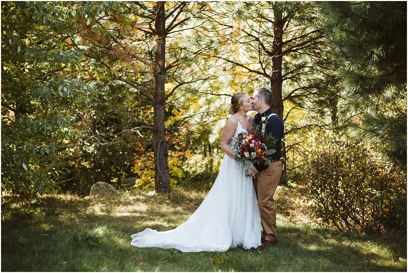 Snohomish & seattle wedding photographer | gsquared weddings photography a bride and groom share a kiss outdoors in a sunlit wooded area surrounded by tall trees This romantic moment is a timeless favorite among wedding couples and is featured in our best of 2019 collection | wedding photo by gsquared weddings