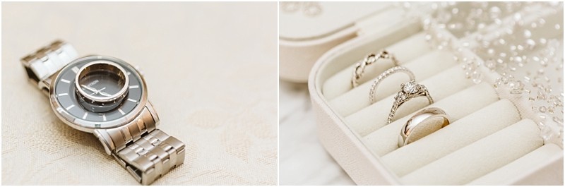 Snohomish & seattle wedding photographer | gsquared weddings photography a silver wristwatch lies on a light surface next to a jewelry box displaying three ringsa diamond engagement ring a delicate band and a simple wedding bandperfect for a marysville wedding with pearl accents nearby | wedding photo by gsquared weddings