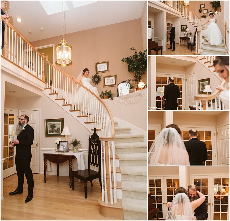 Snohomish & seattle wedding photographer | gsquared weddings photography a bride in a white dress descends a staircase for a first look with a man in a suit and mask he turns and they embrace in the warmly lit elegance of their marysville wedding home | wedding photo by gsquared weddings