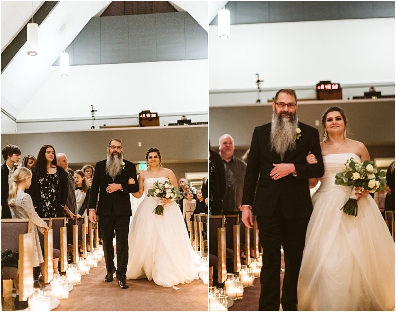 Snohomish & seattle wedding photographer | gsquared weddings photography a bride in a white gown walks down the aisle with a bearded man in a black suit at a marysville wedding surrounded by guests and candlelit lanterns in a church | wedding photo by gsquared weddings