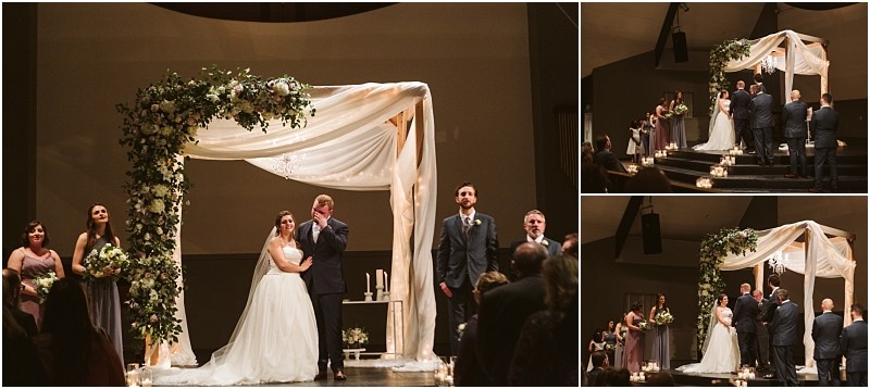 Snohomish & seattle wedding photographer | gsquared weddings photography a marysville wedding ceremony under a floral draped chuppah with the bride and groom standing together as guests watch attendants stand on either side and candles line the floor | wedding photo by gsquared weddings